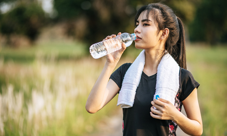 women-stand-drink-water